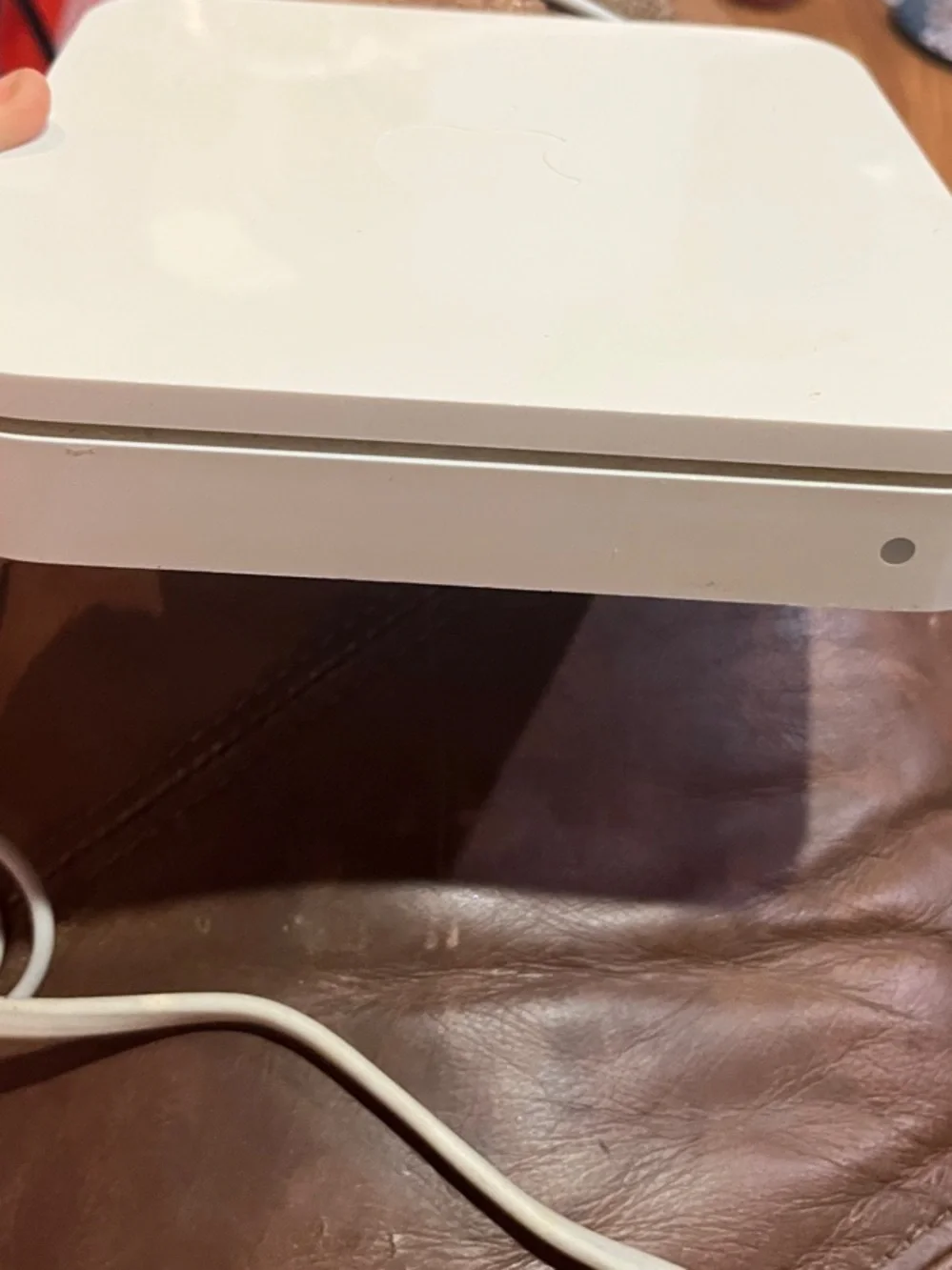 Apple AirPort Extreme base station with power supply.